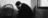 man in corner crying