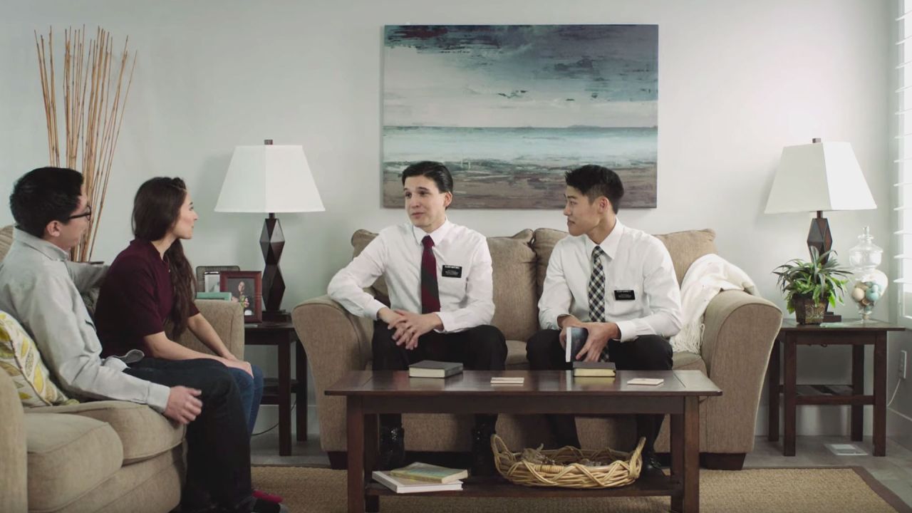 Pair of elders teach a couple in their living room