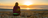 woman watching sunset