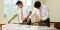 young men preparing sacrament table