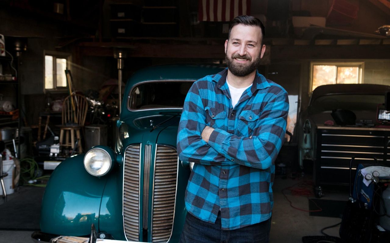 Jared stands in front of a vintage car discussing the blessings of the gospel of Jesus Christ