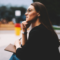 A women ponders the purpose of life on a park bench