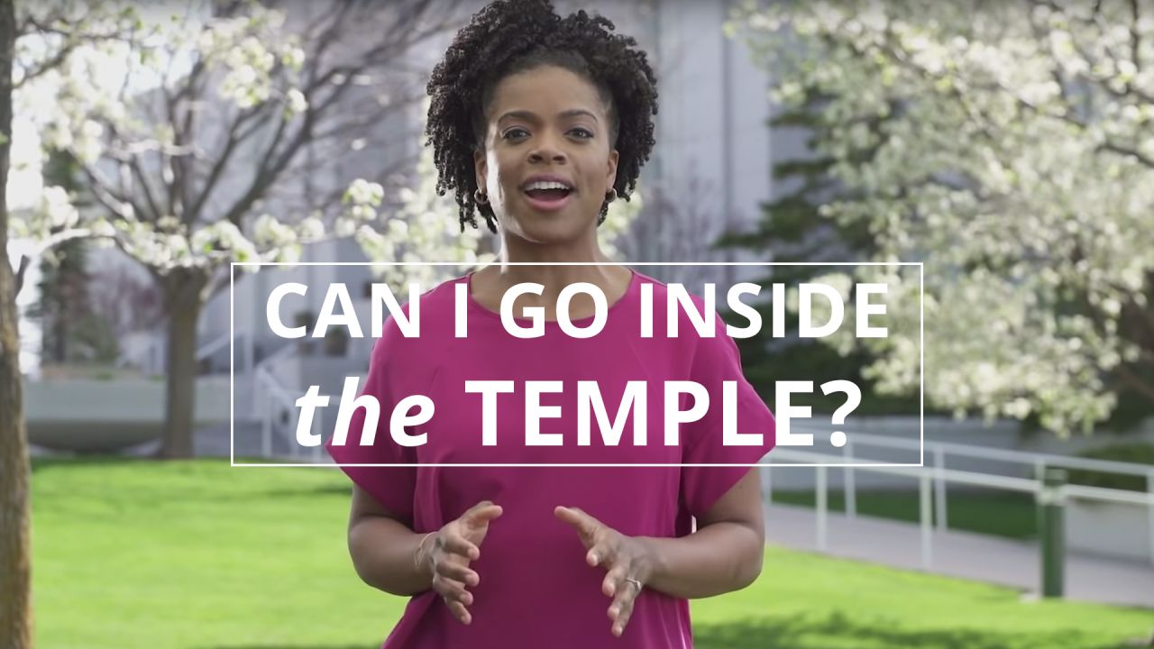 A woman stands outside a temple and explains the purpose of temples of the Church of Jesus Christ of Latter-day Saints