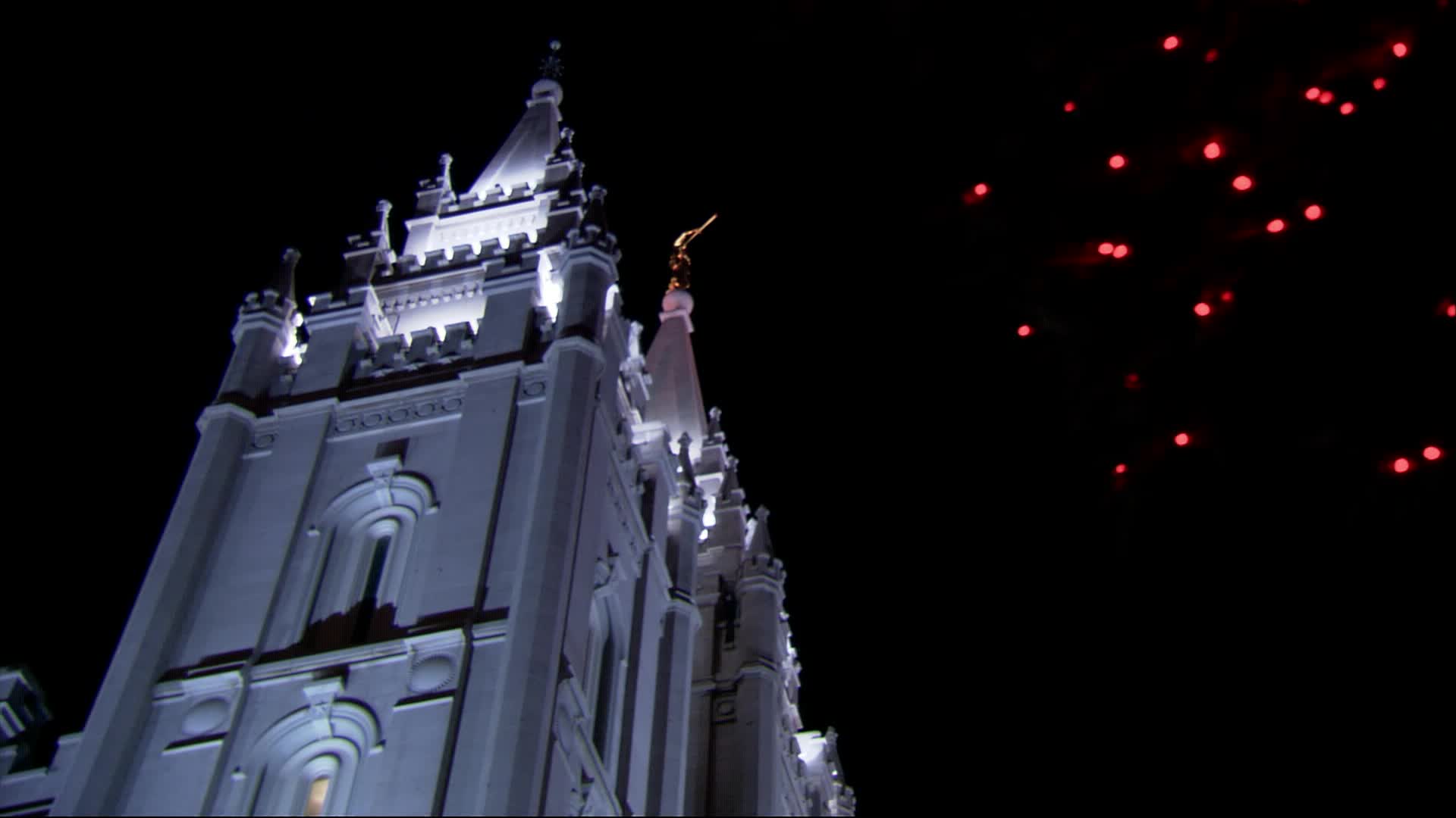 The Salt Lake Temple at night with Christmas lights