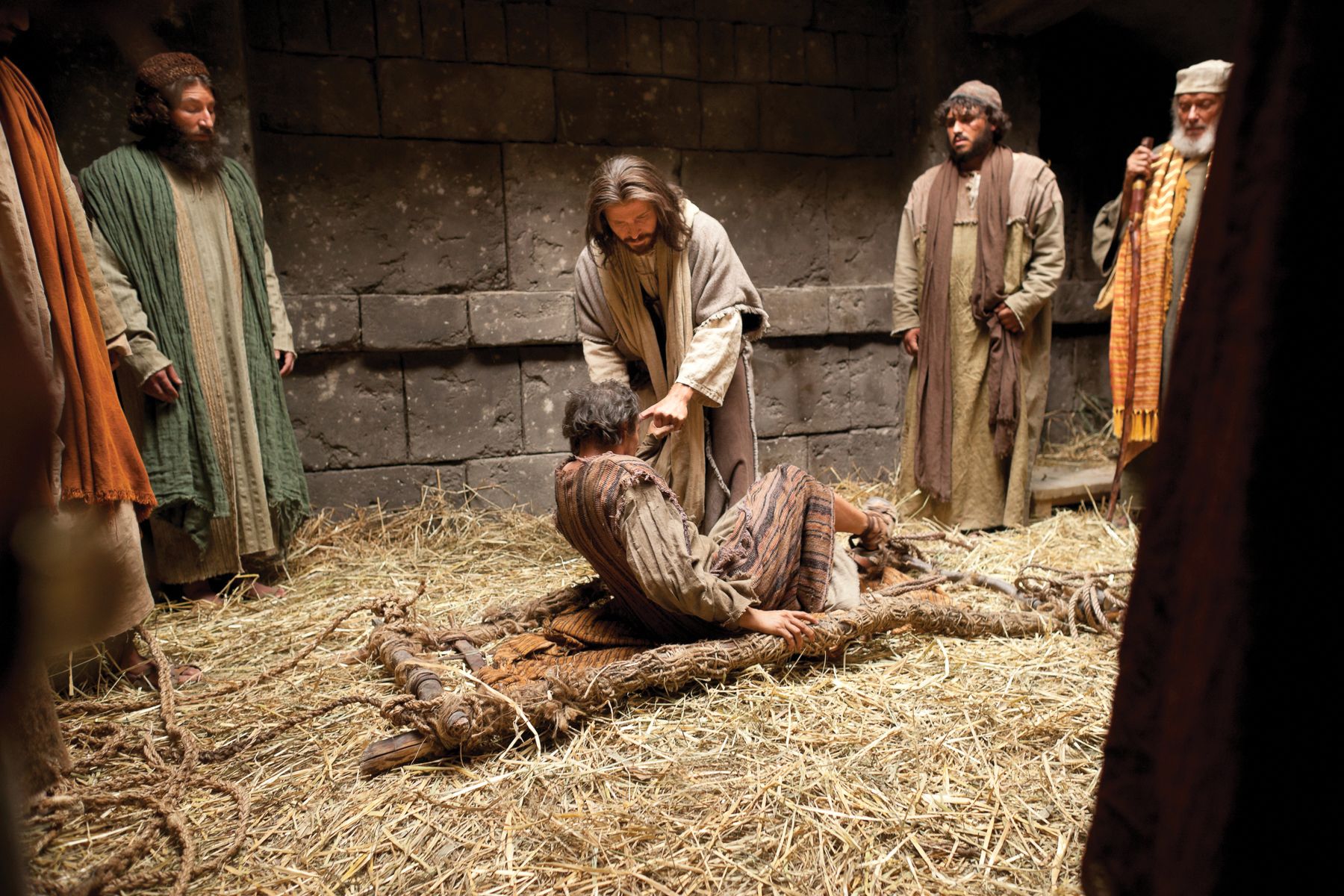 Jesus forgives the sins of the man stricken with palsy and heals him.