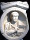 Sculpture of a Man Holding a Book
