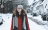 young woman walking in snow