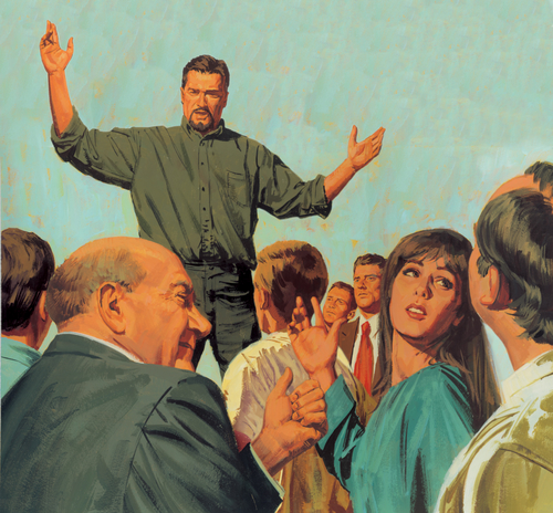 man speaking to crowd
