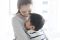Mom and son hugging