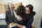 Woman hugging younger woman
