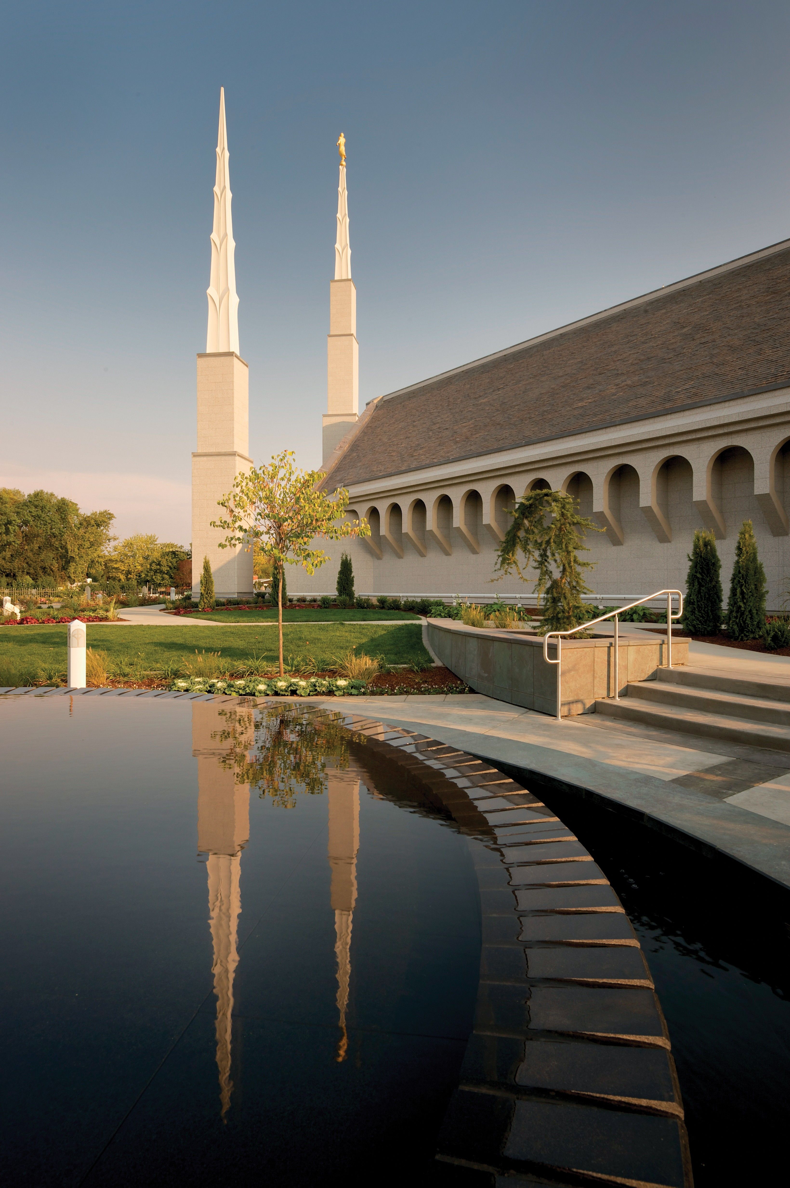 A side view of the Boise Idaho Temple reflected in the pond on the temple grounds.