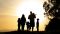 Family silhouette at sunset