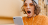 young woman looking shocked at mobile phone