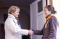 Women greeting girl