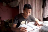 young man studying the scriptures