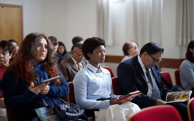 A congregation in a church learn about Jesus Christ