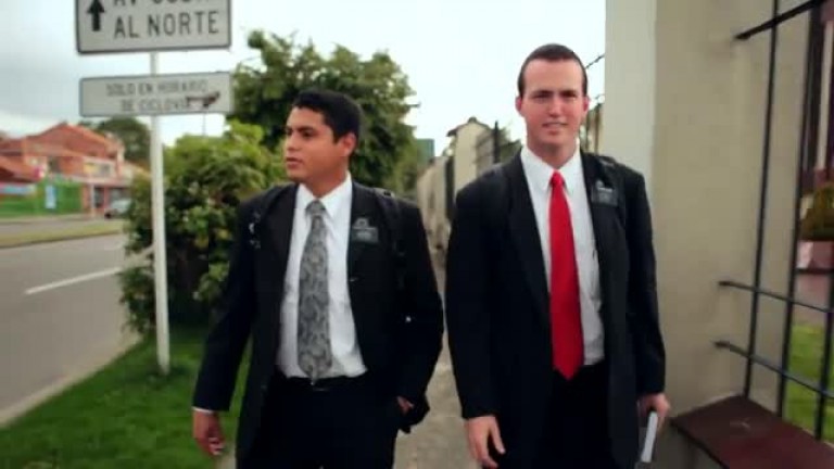 Two missionaries walking on the street