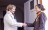 two women shaking hands