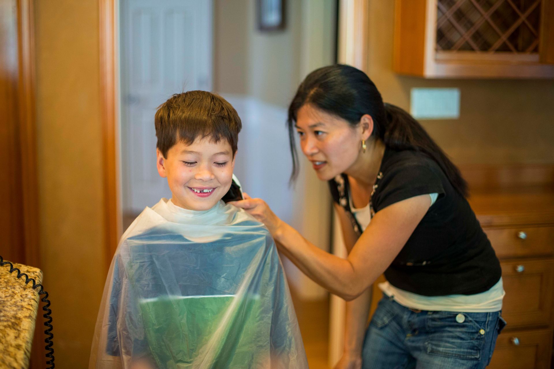 Mother Cutting Sons Hair